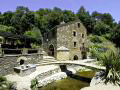 Mill and outdoor area alongside the stream