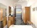 Double bedroom with doors to balcony